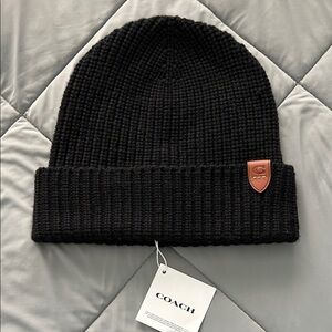 Coach Black Knit Merino Wool Hat with Brown Leather Logo Patch